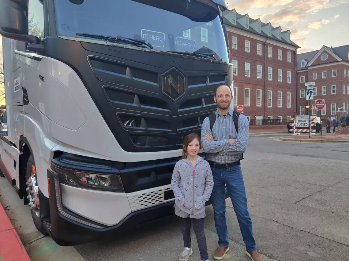             Josh Tulkin, Maryland Sierra Club Director and his daughter gather in front of Nikola’s Class 8 Battery electric truck.