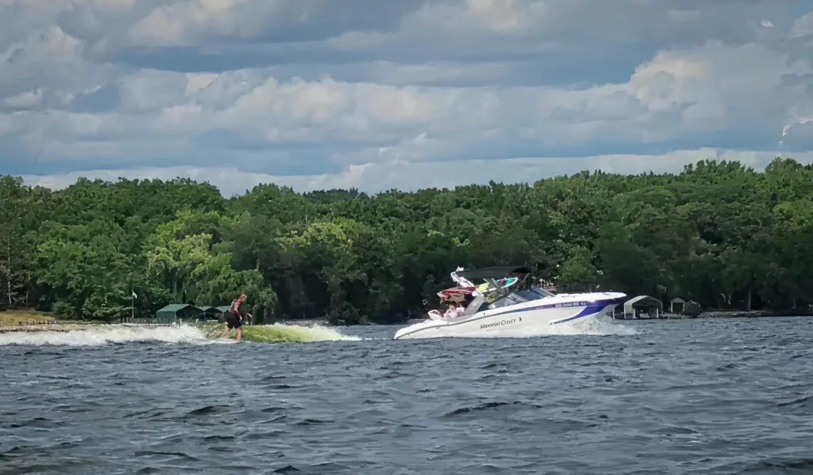 A wake boat in action on a lake. Photo credit: Mark Strand