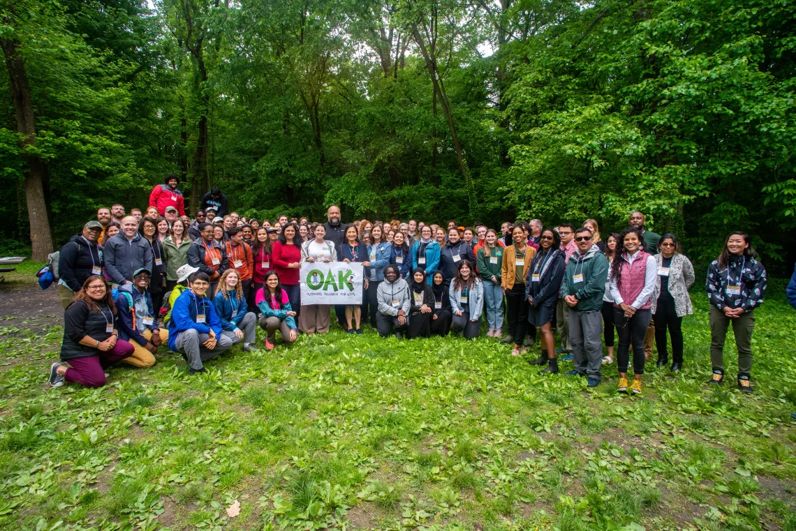 OAK Week 2023 attendees pose with Secretary of the Interior Deb Haaland at Rock Creek Park.