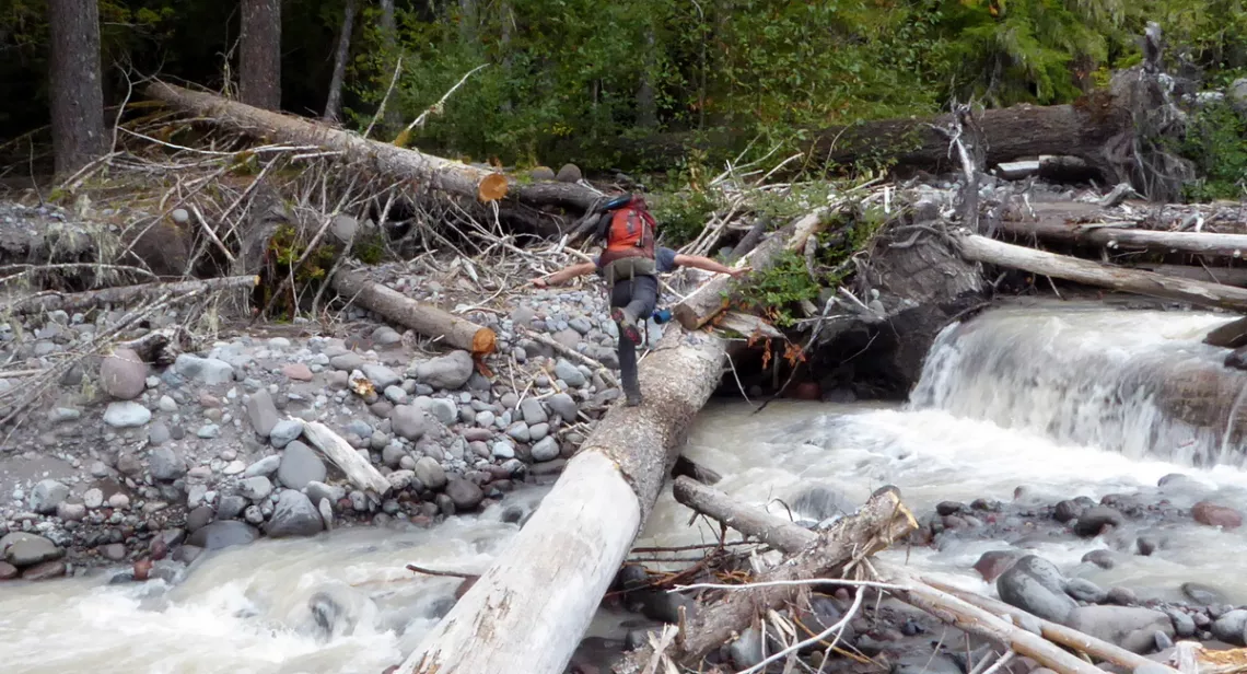 Crossing North Mowich River on the Wonderland Trail in Mount Rainier National Park