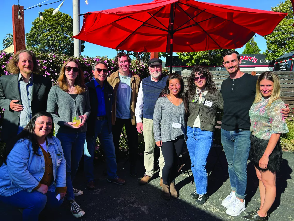 Group of Bay Chapter members gathered on the sunny patio of Factory Bar in Richmond at the May Chapter Mixer.