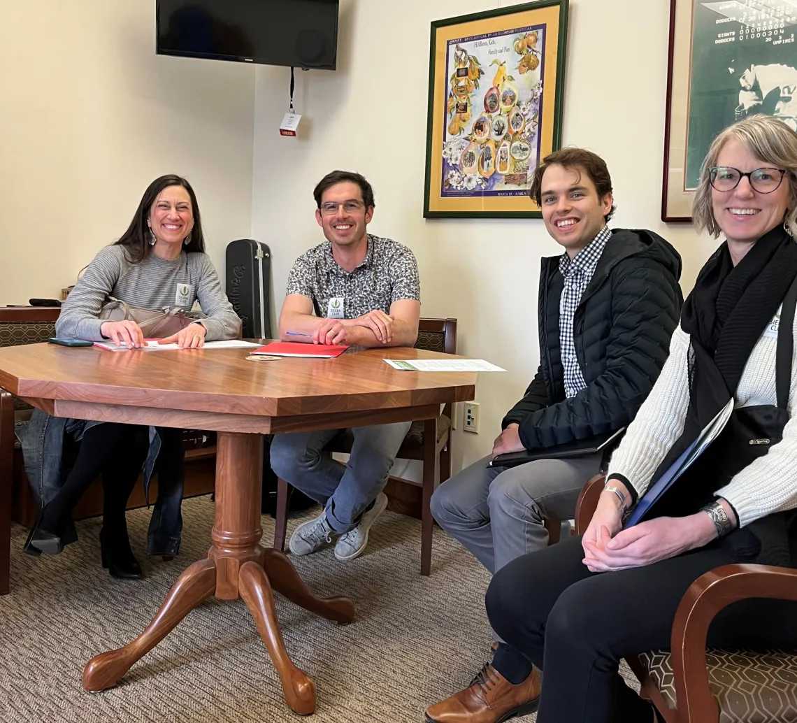 Volunteers pose in Senator Golden's office in anticipation for their first meeting of the day. 