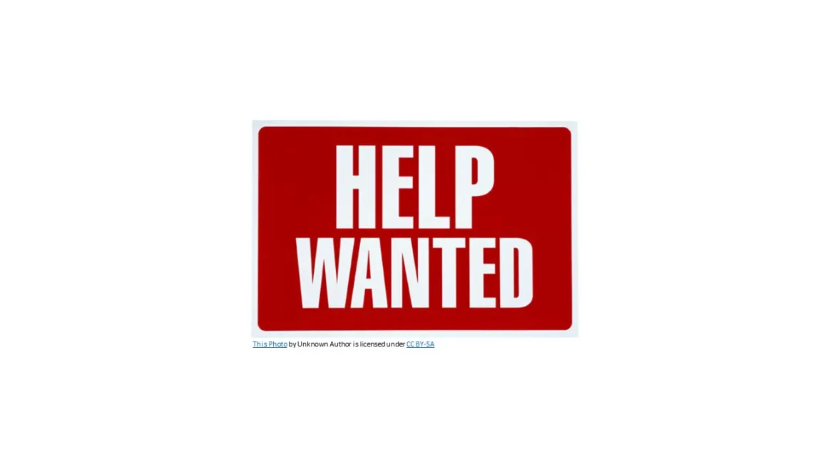 help wanted sign with white letters on red background