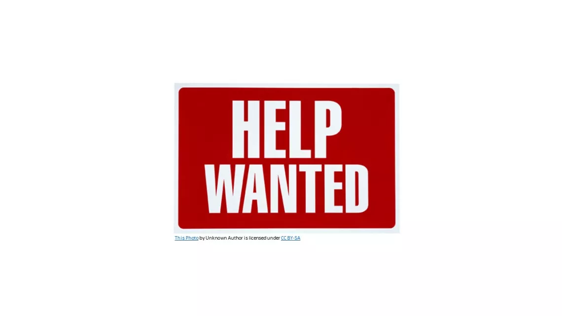 help wanted sign with white letters on red background