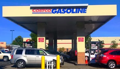 Costco gas station with cars.