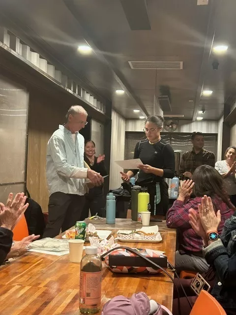 Analuisa accepting a certificate from ICO Chair Al Bellavia