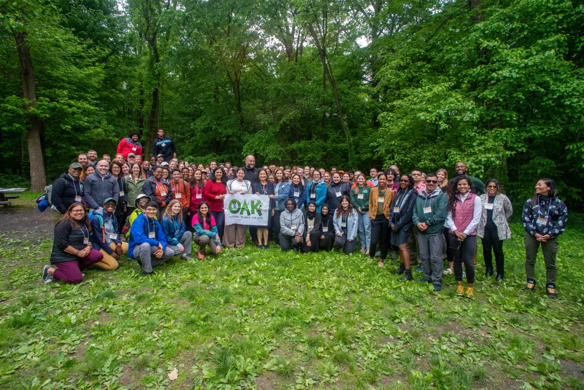 Attendees at the 2023 Outdoors Alliance for Kids Week pose with Secretary of the Interior Deb Haaland.