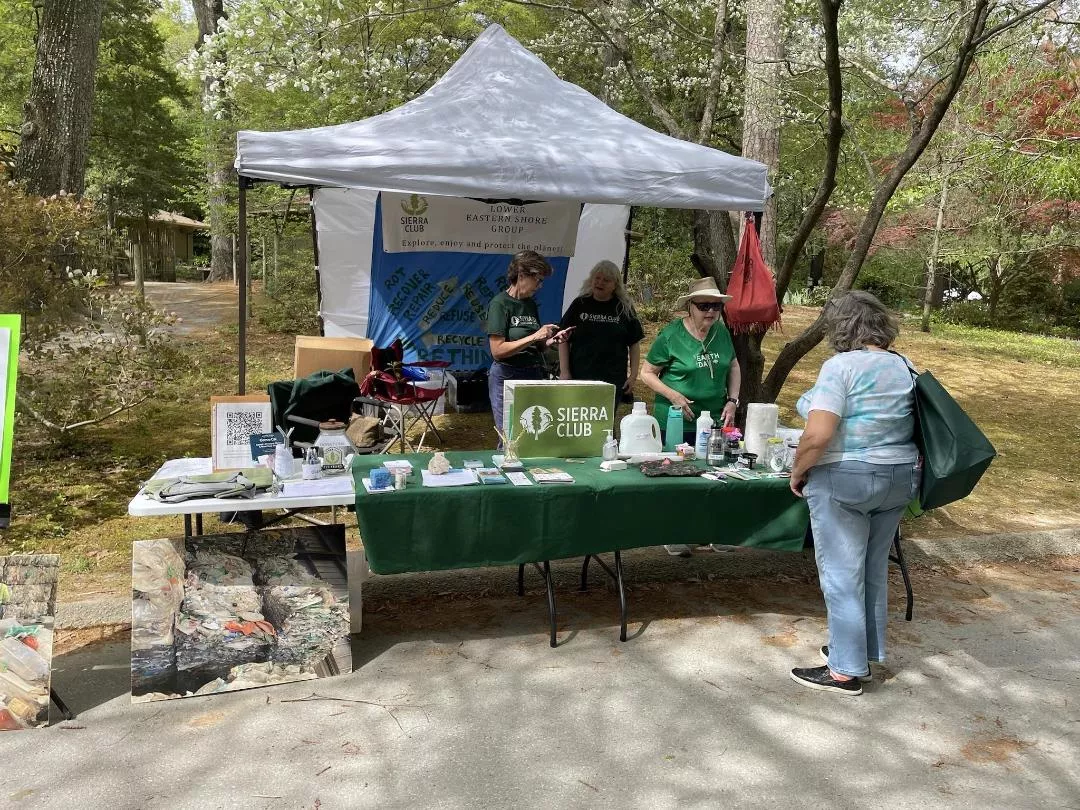 Visitors at Salisbury Zoo Earth Day stop by Sierra Club display