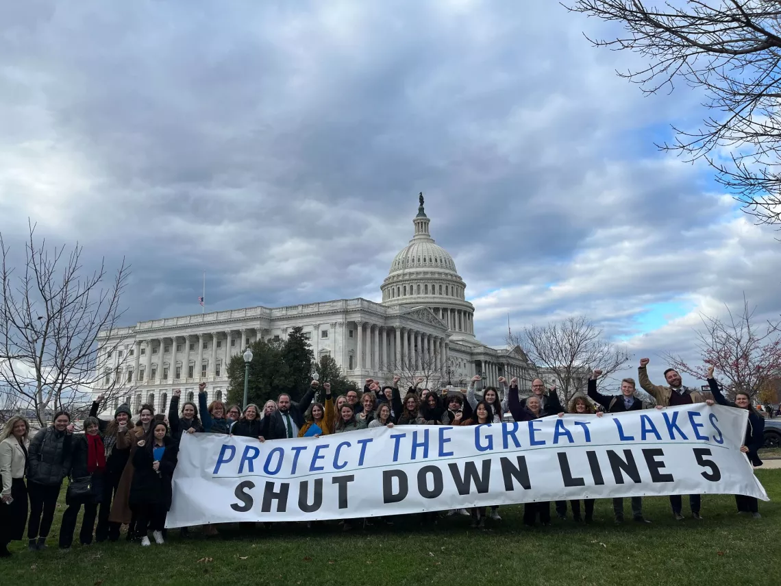 protesters of Line 5 holding banner in front of White House
