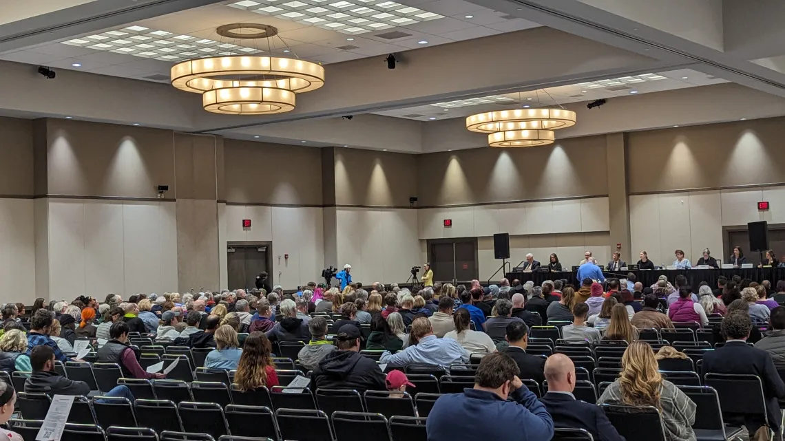 A packed room of hundreds of people for a rate case hearing.