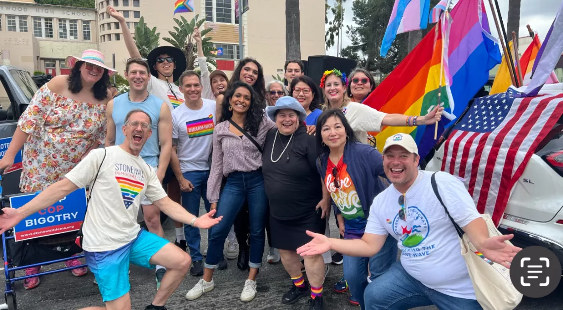 Caption: Supporting the Stonewall Democrats at LA Pride and cheering the iconic LGBTQ+ annual LA Pride parade down Hollywood Blvd.