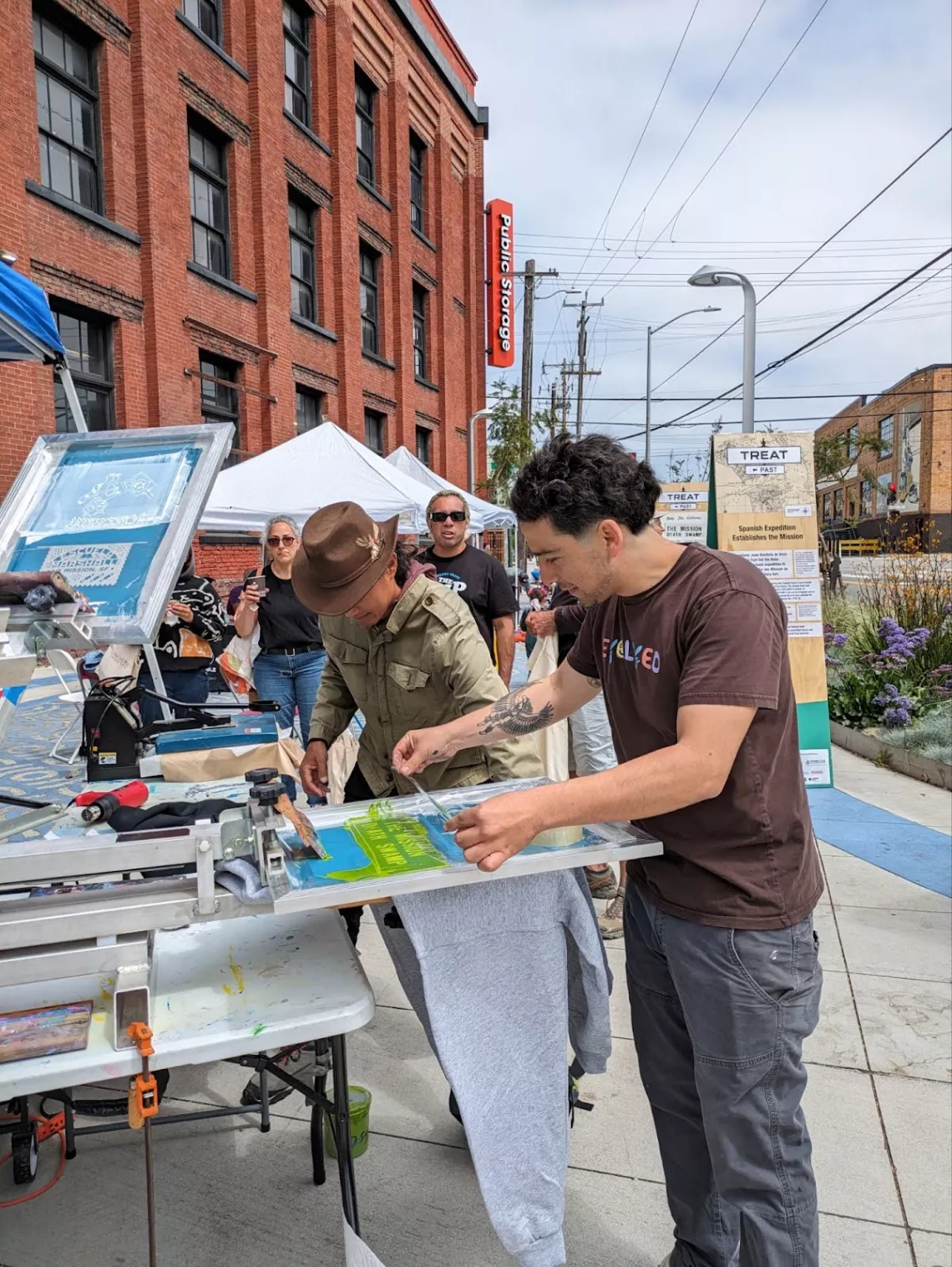 People screenprinting during community outreach