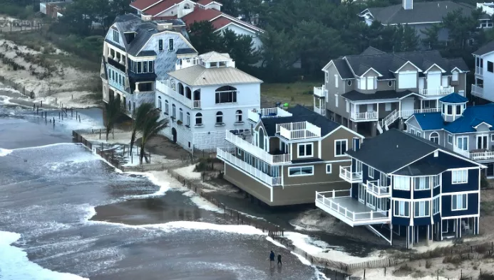 Sea-level rise will cause expensive damage, not just to beachfront properties like these homes south of Dewey Beach. Photo Credit: Chris Driscoll