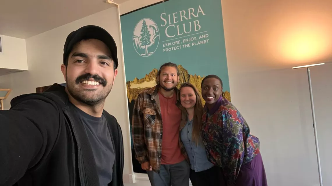 staff in front of Sierra Club sign
