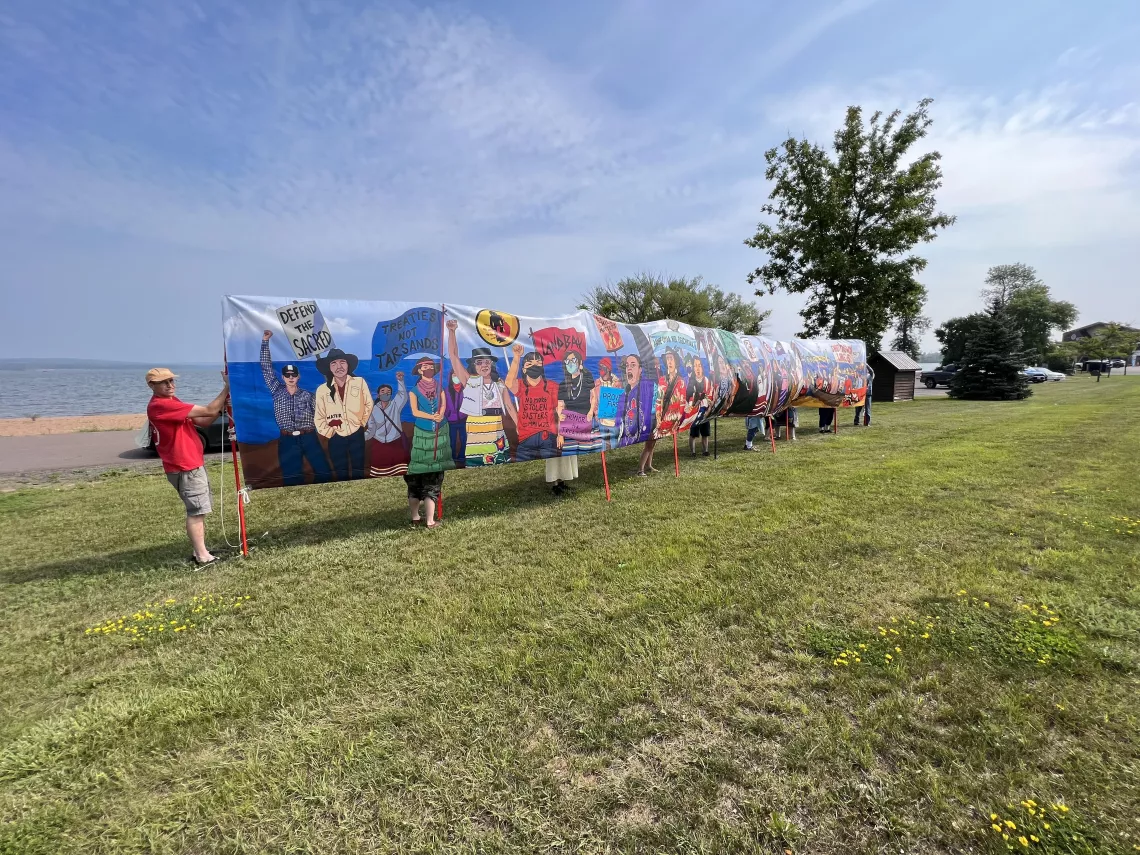 Community members gather to raise awareness about Line 5 as a living mural in Wisconsin (August 2023)