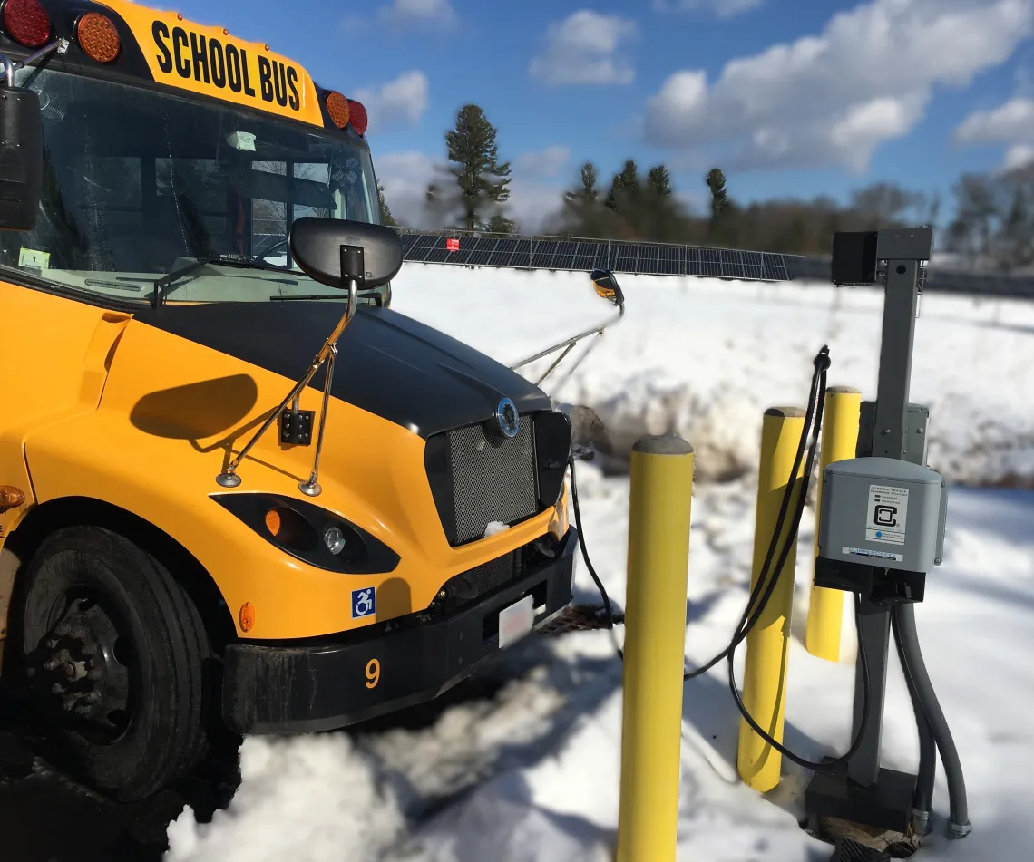 school bus charging in the snow