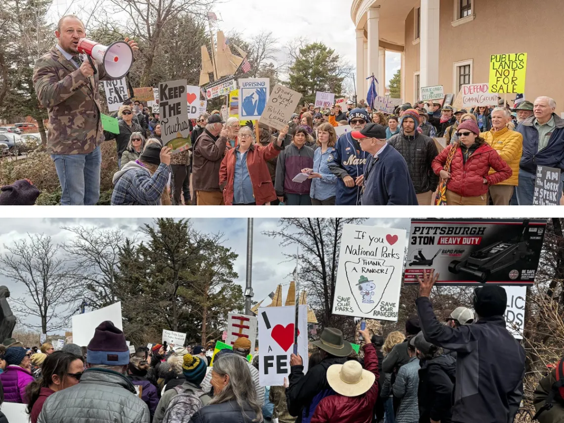 A group of people holding rally signs.