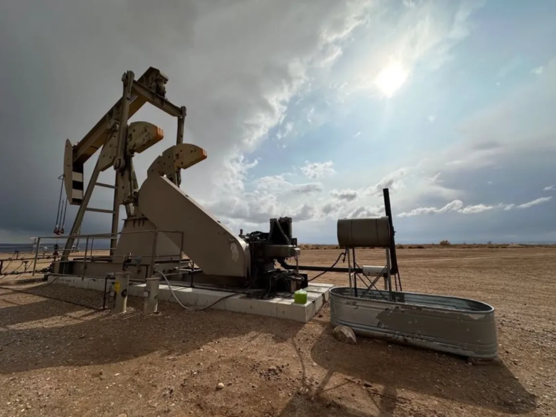 Oil and gas infrastructure in front of a blue sky