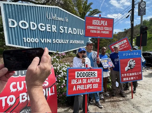Dodgers fans protest the team's sponsorship with 76