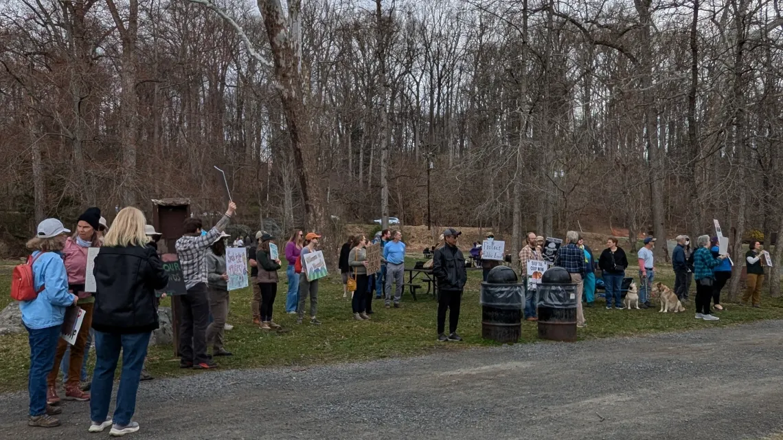 a group of people holding signs