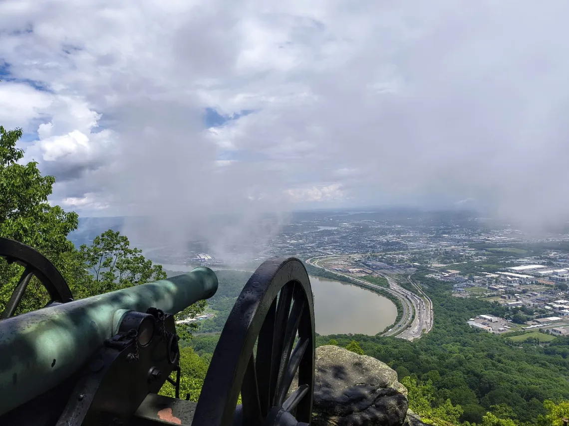 cannon statue points toward clouds