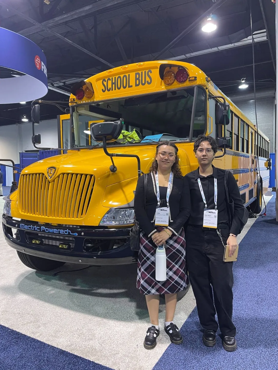 Sierra Club Volunteers in front of electric school bus