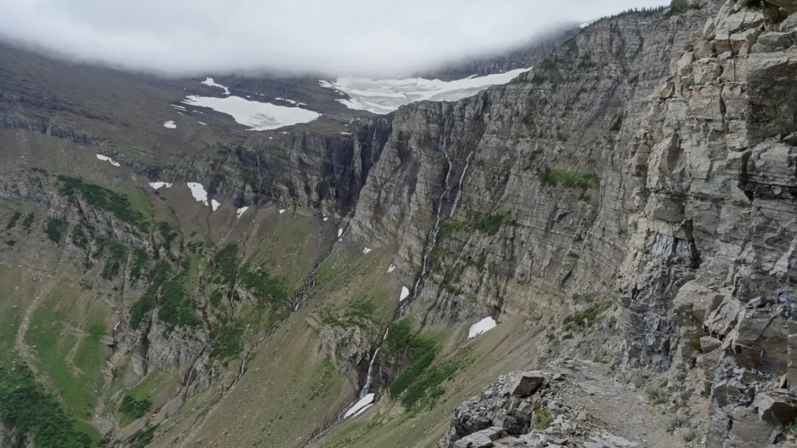 At a switchback on Swiftcurrent Pass trail, visible lower right
