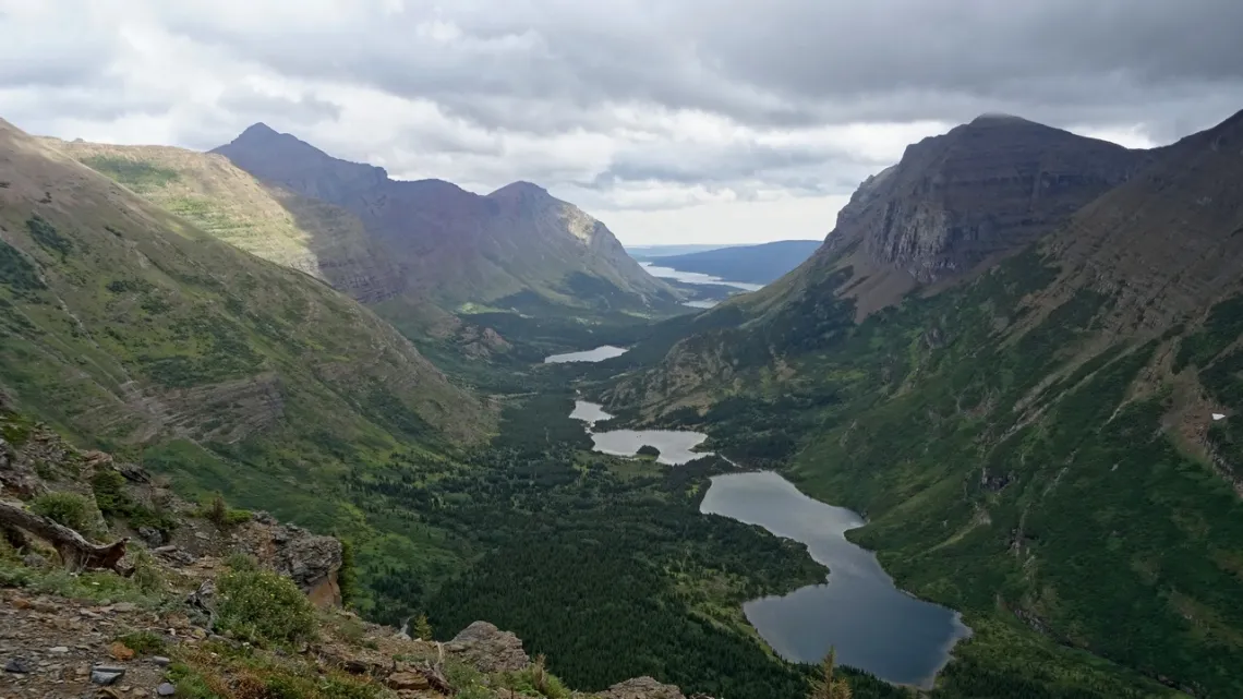 Looking ENE from Swiftcurrent Pass. The trail passes the lakes to the left.