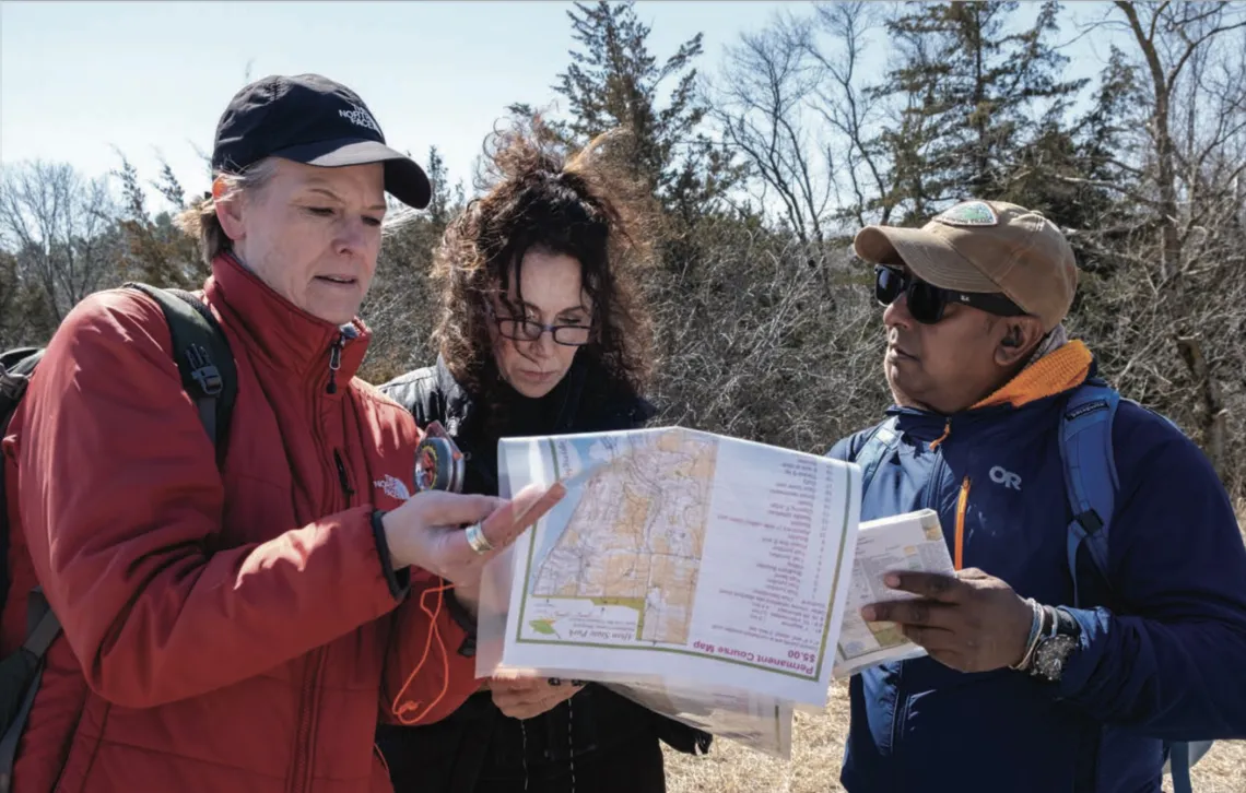 JR Hunte and outings participants on a backcountry navigation course. Photo Credit: Devon Young Cupery