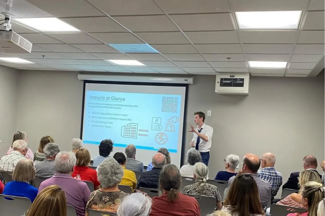 Staff member educating people on data centers