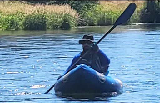 Anthony Pasquale Paddling Down a River