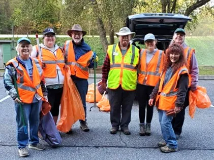 members with equipment  at the adopt a highway outing