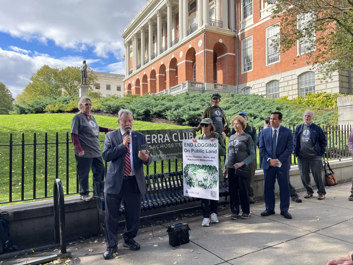Speakers at a rally in front of the State House