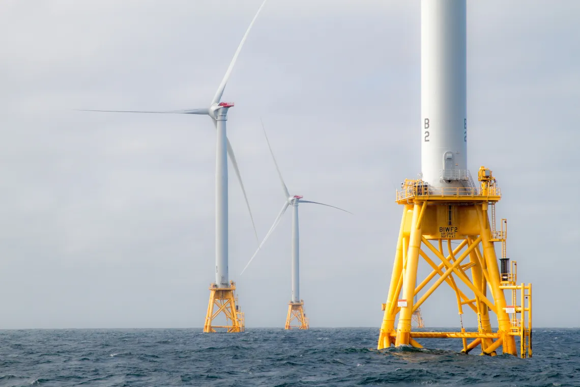 image of offshore wind turbines in the ocean.