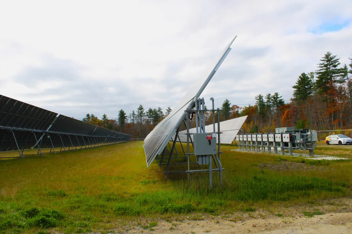 Rows of two-sided Solar panels in a field