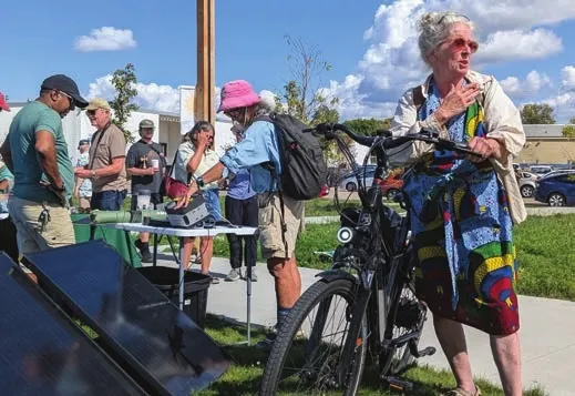 Enjoying the sun, electric bikes and solar energy at the Sun Day Festival in Minneapolis. Photo credit: Mary Blitzer