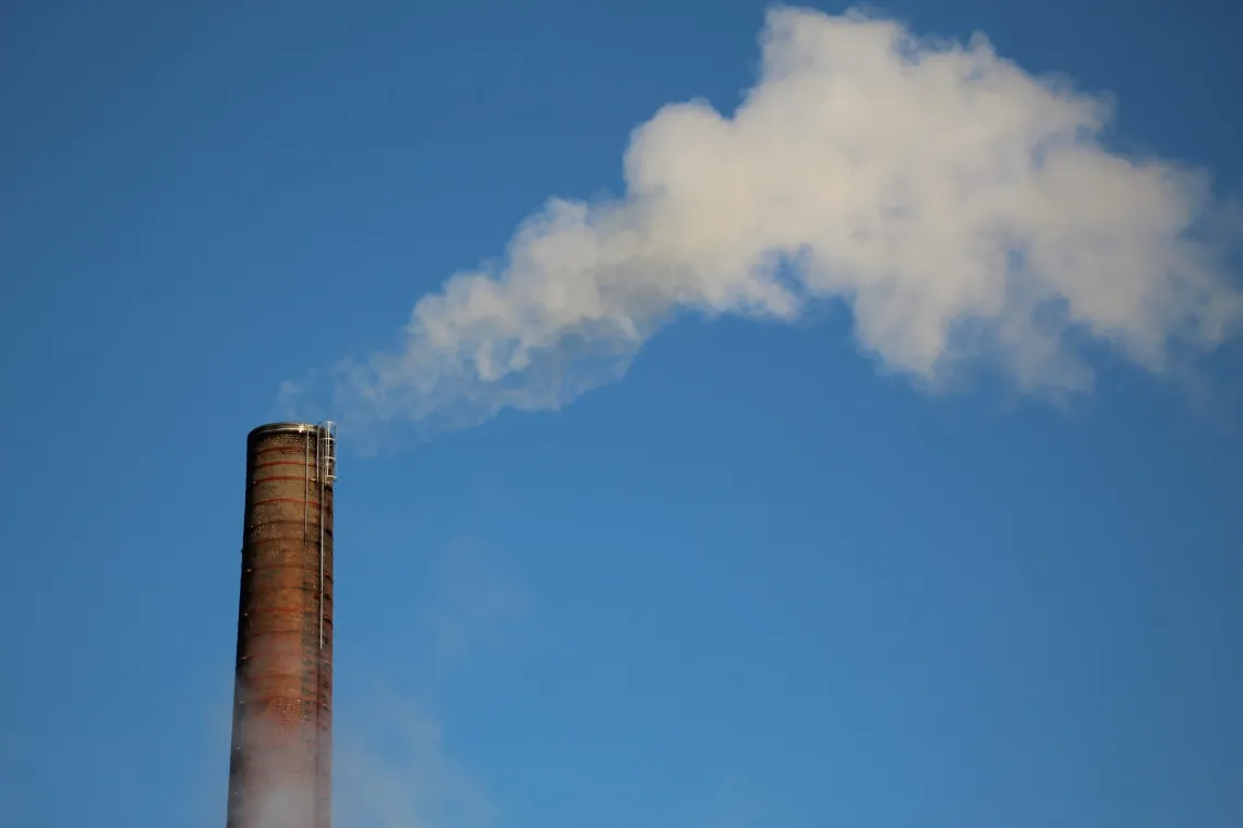A smokestack releasing steam.