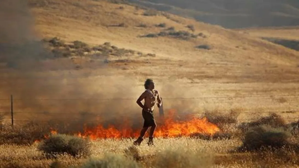 Arsonist fleeing from fire.