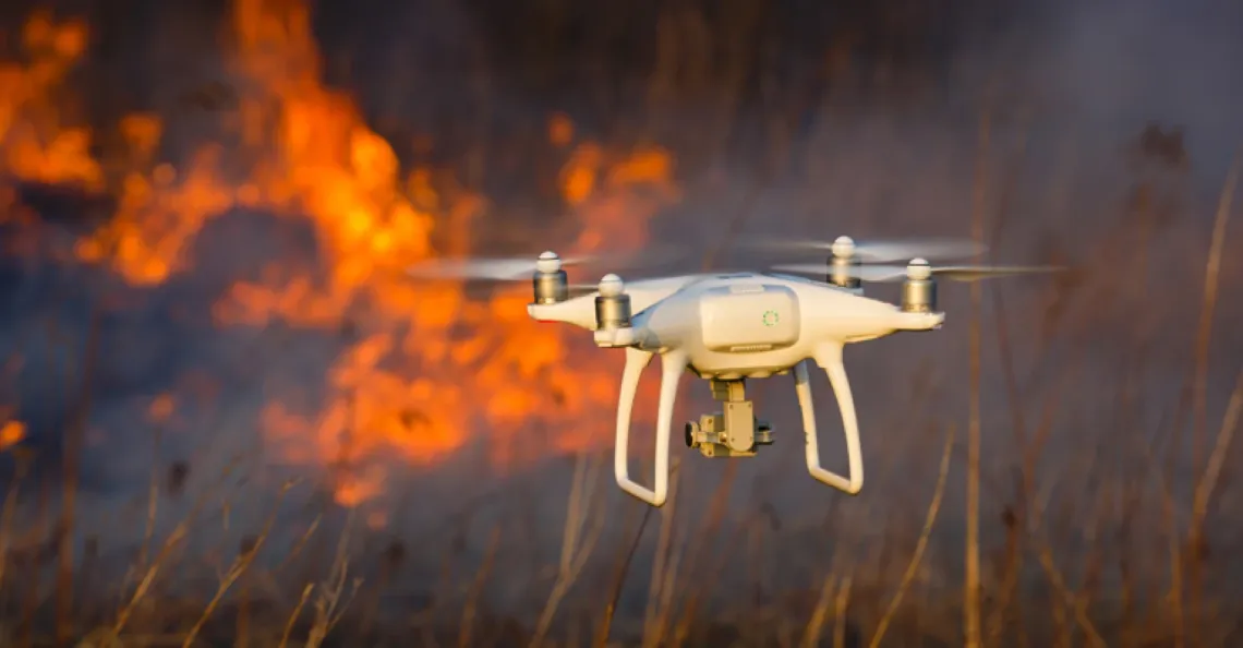 Drone flying over a wildfire