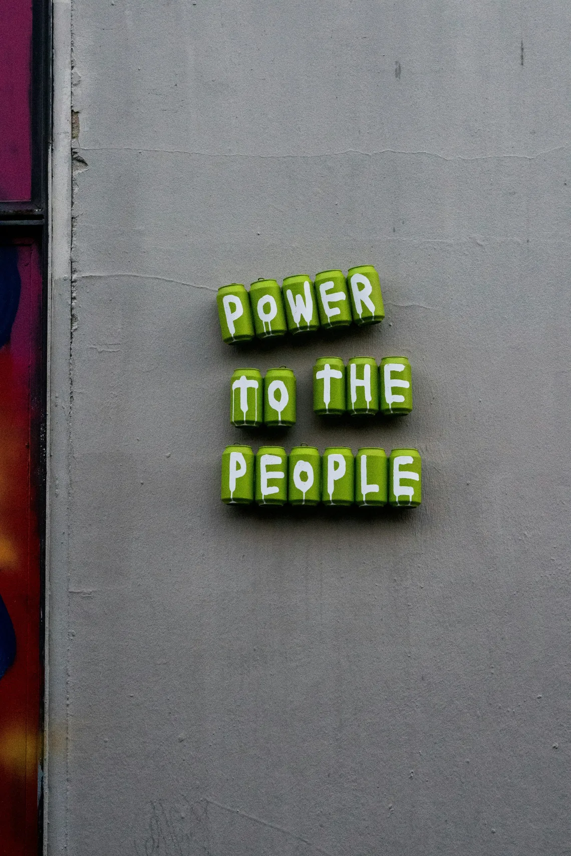 Letter beads that spell "Power to the people".