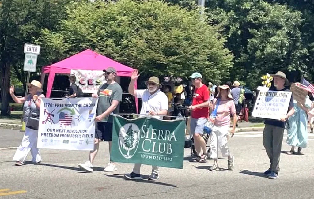 Getting Ready to March. Left to Right: Stan Jaracz (NJ Electric Vehicle Association), Noemi Giszpenc as Lady Liberty (Bnai Keshet/Interfaith Climate Action), Autumn Wagner (Sierra Club), Collumb Mahoney (Sierra Club), David Wasmuth (Northeast Earth Coalition), and David Korfhage on his electric bike (Montclair Climate Action).  Picture taken by Bill Beren.