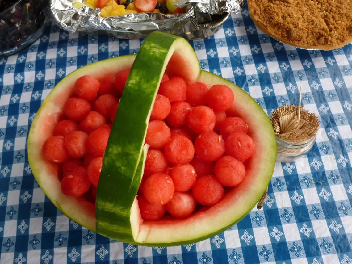 watermelon fruit basket on picnic table