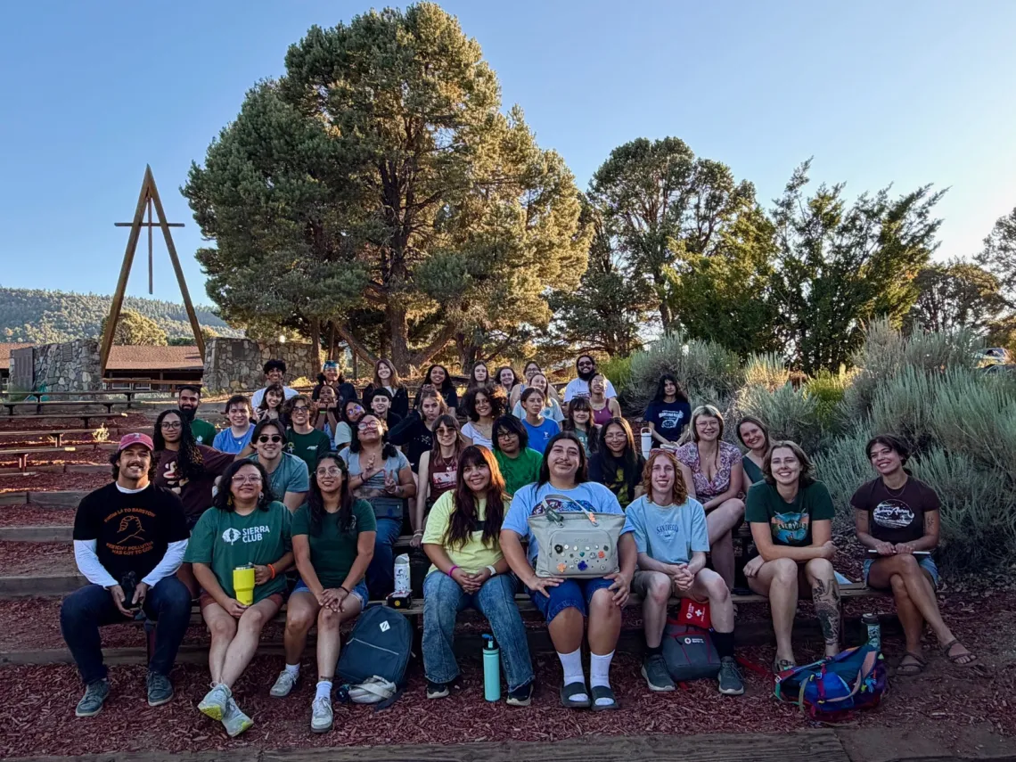 Group of youth activists gathered on wooden benches for SPROG 2026