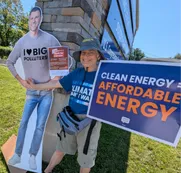 Volunteer with cardboard cutout of Rep. Ryan Mackenzie