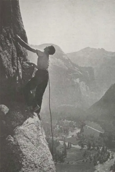 Young man rock climbing