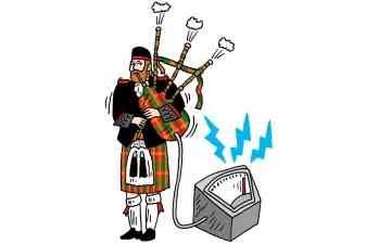 Photo of a Scottish person playing the bagpipes hooked up to a generator