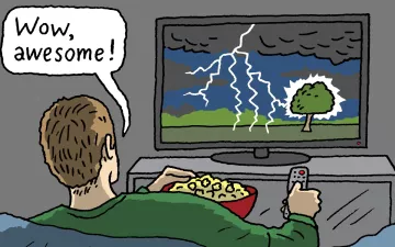 person watching a lightening strike on tv