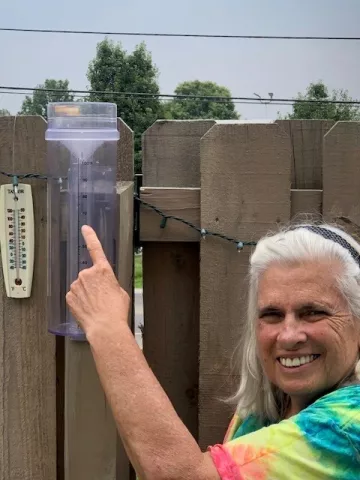 Joanne Logan with rain gauge