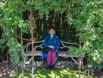 Virginia Small in bench in trees