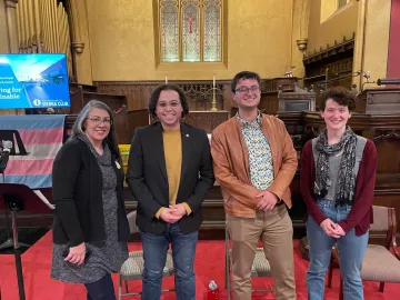 Sam and panelists at municipal climate leadership summit